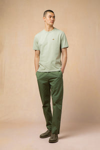 A model wearing the KESTIN Cargill T-Shirt in Green.