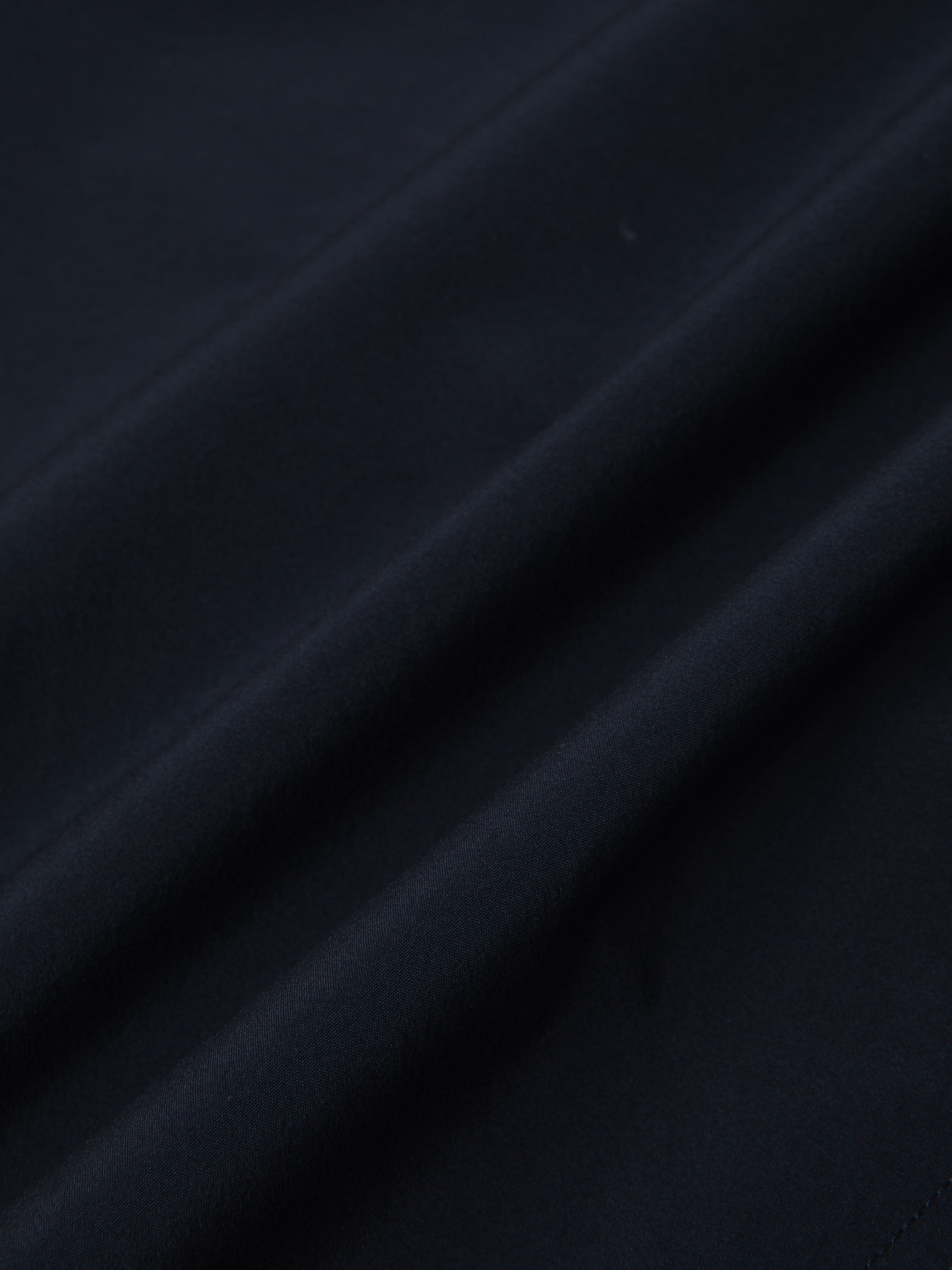 A navy blue technical fabric from 37.5, used by menswear brand KESTIN.