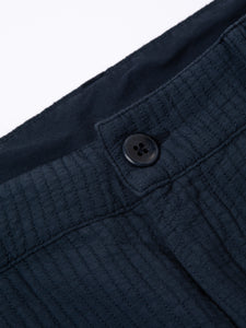 The button to the flt of the KESTIN Aberlour Pants in navy blue.