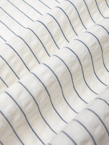 A seersucker fabric with a stripe pattern, used by menswear brand KESTIN.