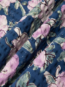 A printed floral seersucker fabric, used to make a premium short sleeve shirt.