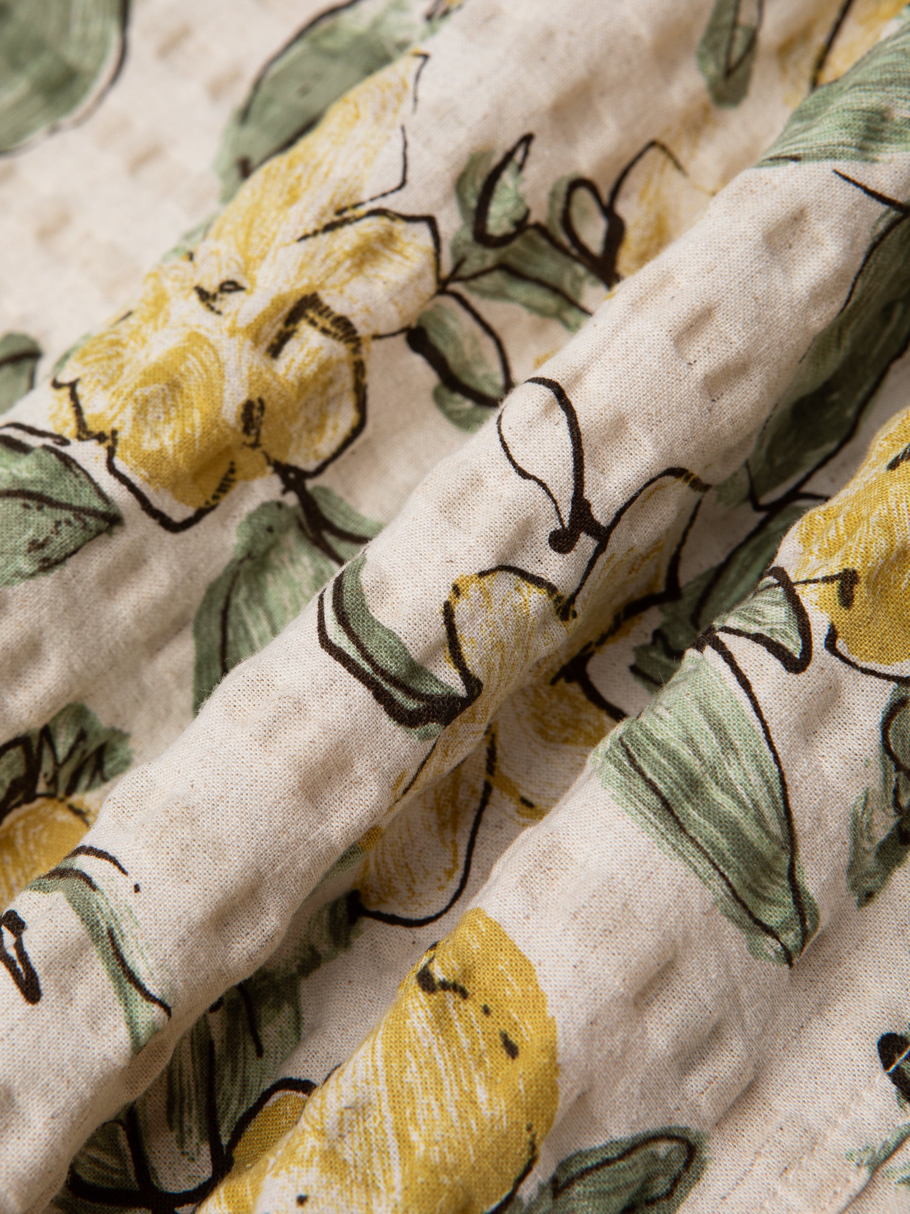 A premium cotton/linen blend seersucker fabric, with a floral print.