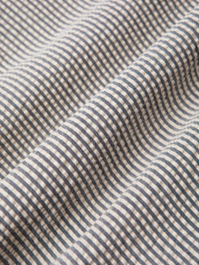 A seersucker fabric used by menswear brand KESTIN to make trousers.