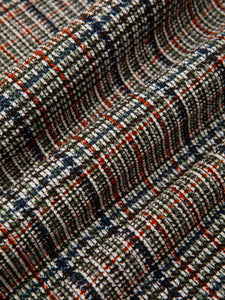 A printed olive green check pattern, used to make shirting by menswear brand KESTIN.