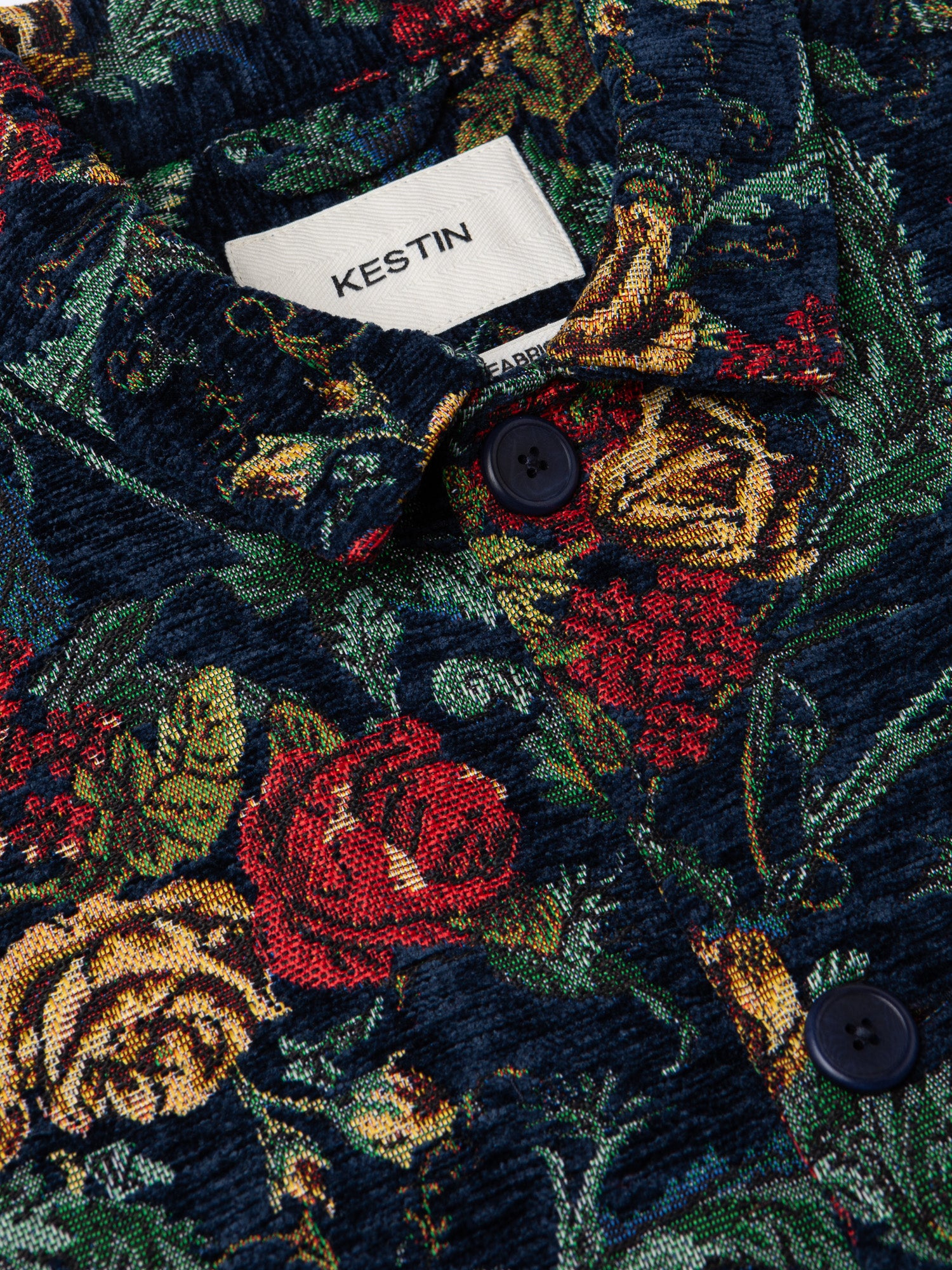 The buttons, collar and neck label of the KESTIN Ormiston Jacket in floral jacquard.