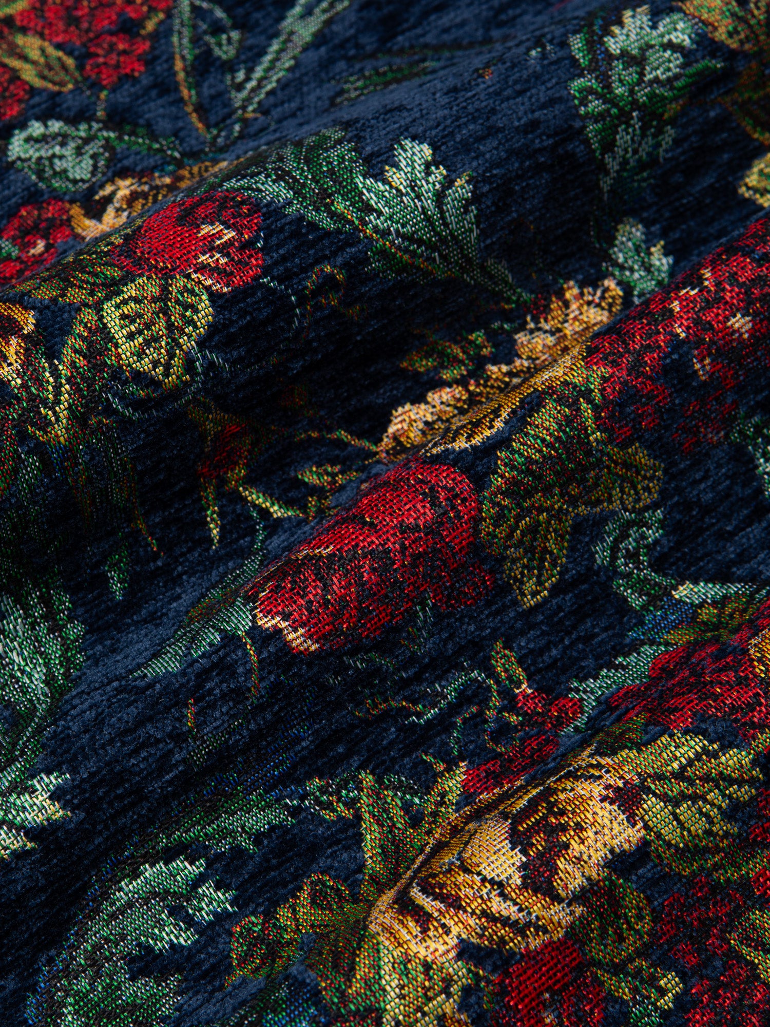 A close-up of a blue floral jacquard fabric, used by menswear designer KESTIN.