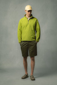 A model wearing shorts and a zip neck from Scottish menswear brand KESTIN.