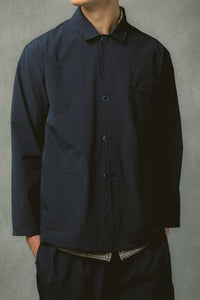 A model wearing a technical, temperature-regulating jacket.