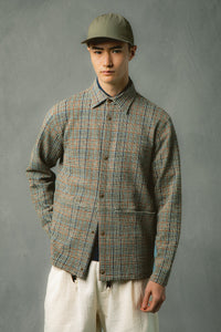 A model wearing a jacket, cap and trousers from Scottish designer KESTIN.