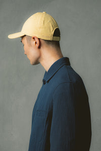 A man wearing a casual jacket and a colourful cap from Scottish designer KESTIN.