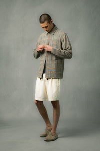 A model buttoning in a casual jacket from Scottish designer KESTIN.