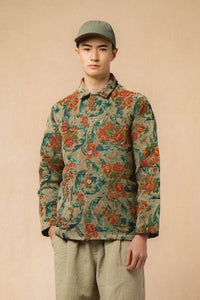 A model wearing the Ormiston Jacket in olive floral, from menswear designer KESTIN.