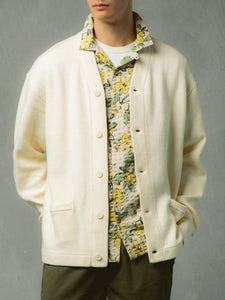 A cardigan layered over a floral shirt from premium menswear designer KESTIN.