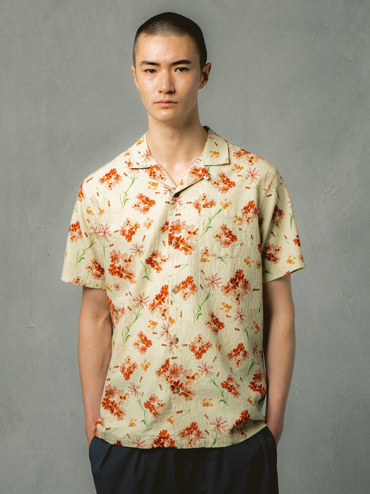 A model wearing a short sleeve  floral shirt from menswear brand KESTIN.