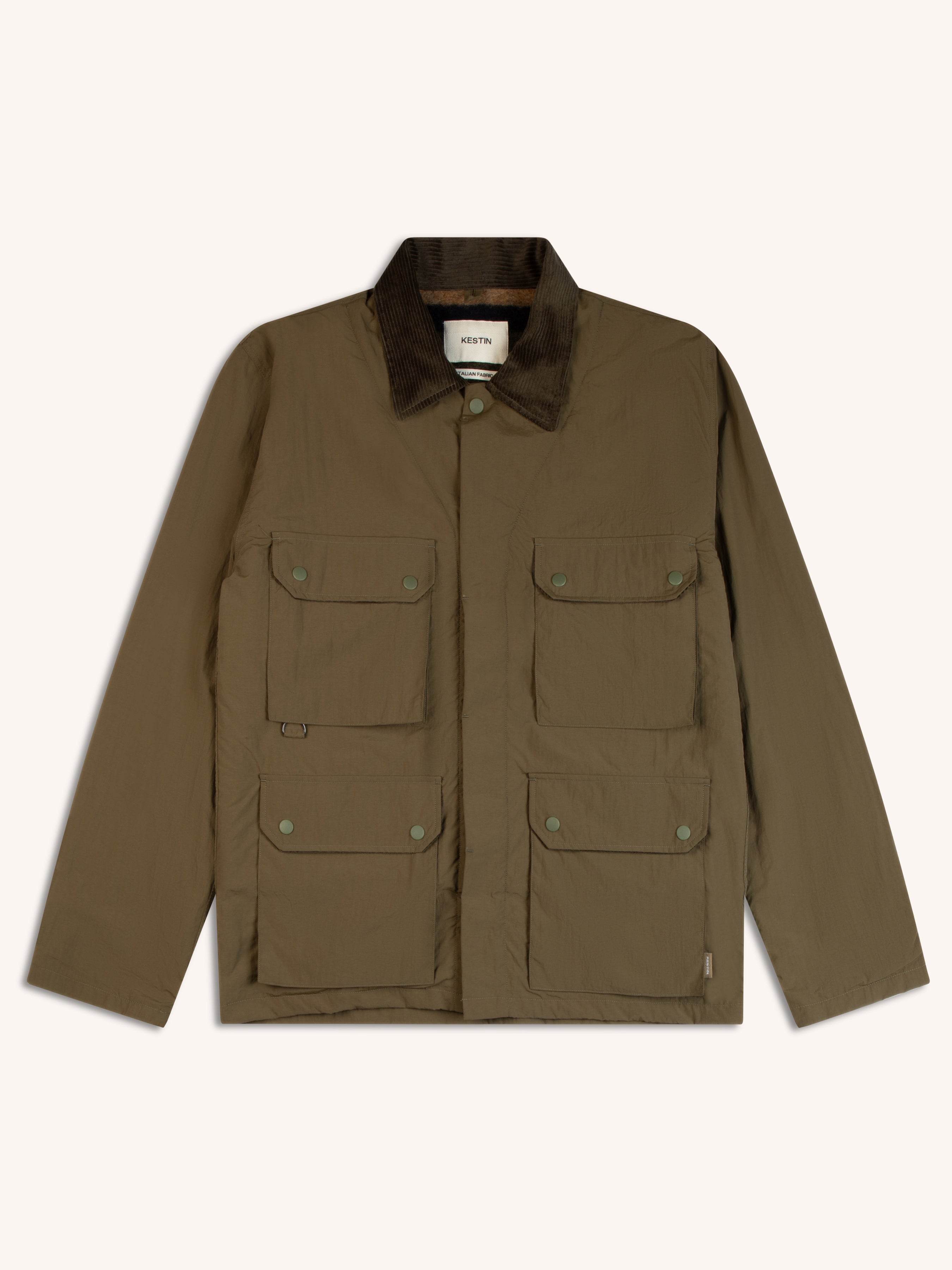 A green countrywear inspired jacket with a corduroy collar and four pockets.