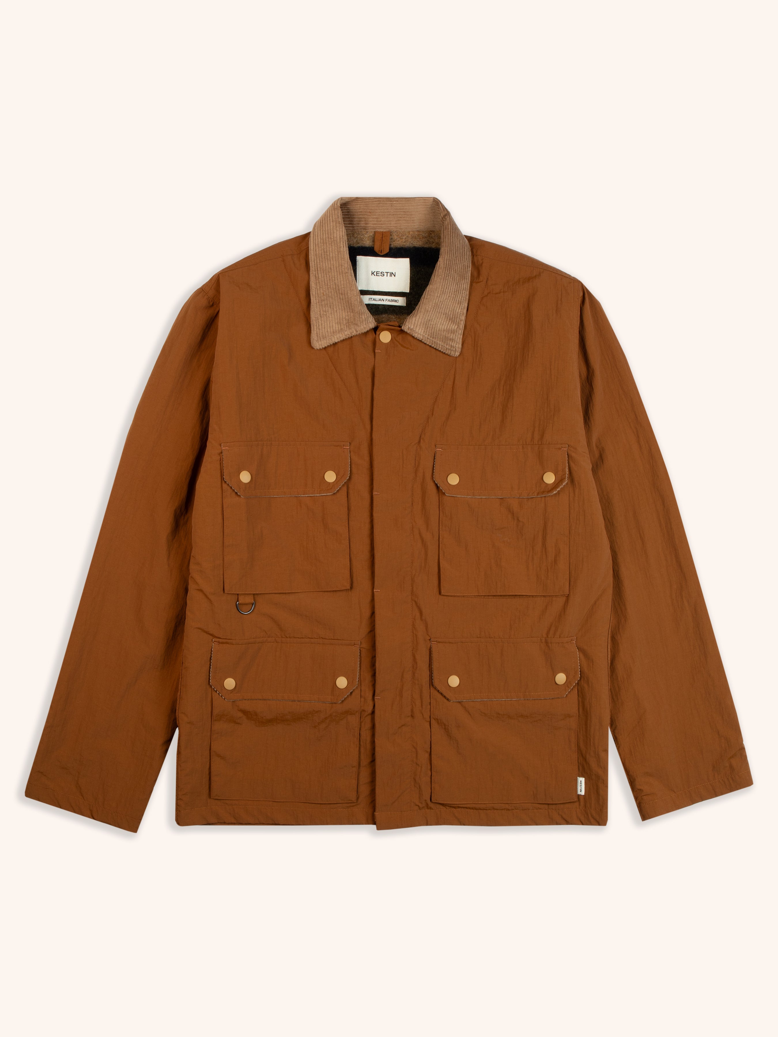 A brown country style jacket with four pockets and a corduroy collar.