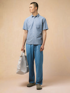 A model wearing a short and chambray trousers from KESTIN.