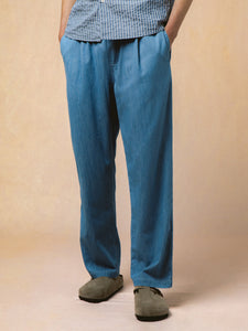 A model wearing chambray trousers with Birkenstock Bostons.