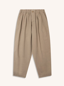 A pair of relaxed fit men's trousers in khaki beige, on a white background.