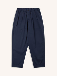 A pair of relaxed tapered fit trousers in navy blue but menswear designer KESTIN.