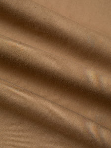 A cotton twill fabric in a beige/khaki colour, used to make KESTIN Trousers.