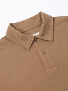 A close-up of the collar of the KESTIN Dunn Polo Shirt in Tan.