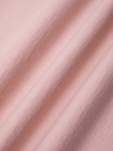 A heavyweight cotton jersey fabric in pink, used to make the KESTIN Fly Tee.