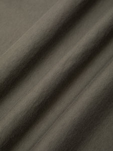 A heavyweight cotton fabric in olive green, used to make KESTIN T-shirts.