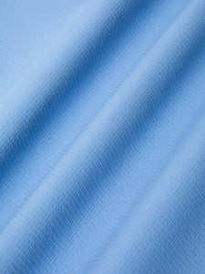 A nylon ripstop fabric in bright blue, used in the KESTIN SS25 Collection.