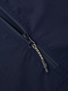 The YKK neck zipper of the KESTIN Aberfeldy Windbreaker in navy blue.