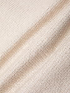 An ecru linen and cotton waffle fabric, used to make the KESTIN Ormiston Jacket.