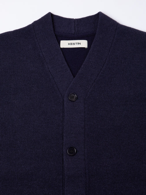 A close-up of the front of the KESTIN Glencorse Cardigan in navy blue.