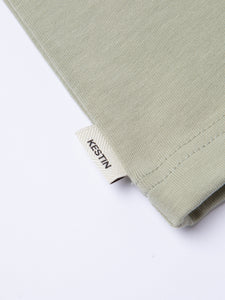 A woven logo flag label to the side of the KESTIN Cargill Tee.