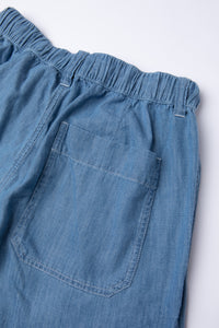 The rear pocket of the KESTIN Doune Pant in washed denim.