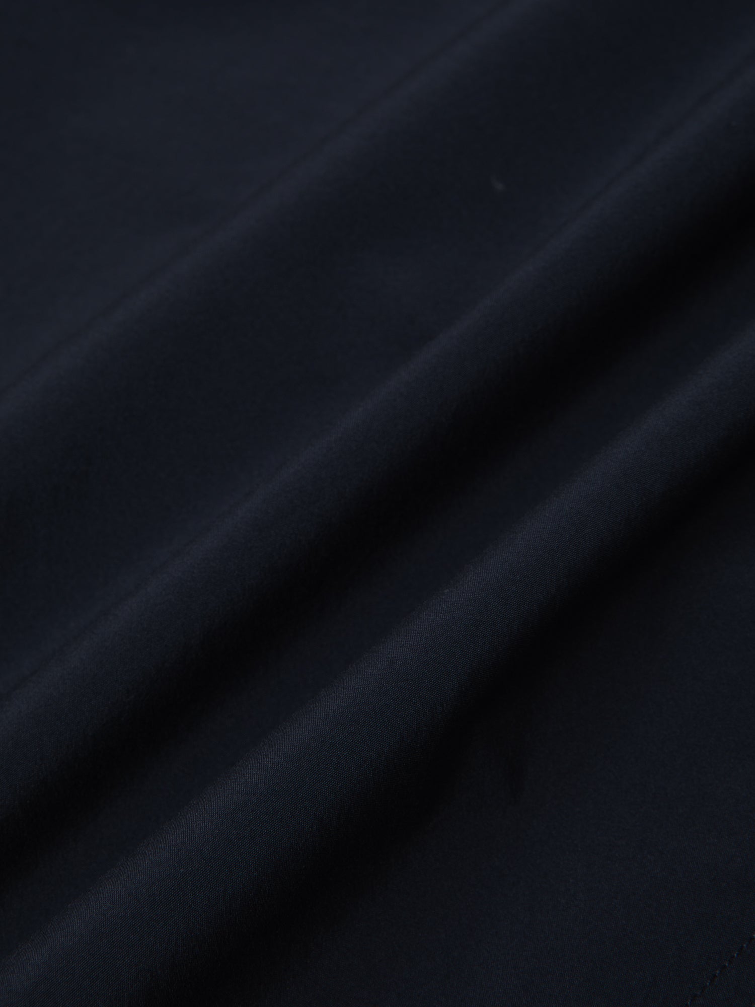 A lightweight technical fabric in navy blue, used by menswear brand KESTIN.