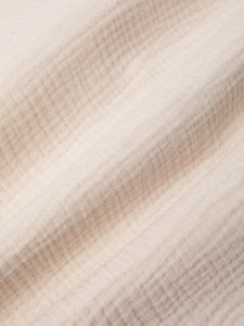 A soft, textured cotton fabric in ecru, used to make the KESTIN Crammond Shirt.