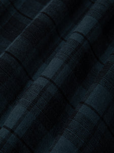 An overdyed check fabric, used to make the KESTIN Kinnaird Shirt.