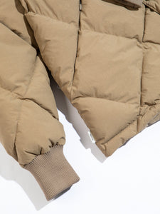 A ribbed cuff on a men's down jacket. The KESTIN Dunbar Jacket uses recycled materials.