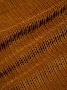 An irregular corduroy fabric, in medium brown, used to make the KESTIN Wick Trousers.