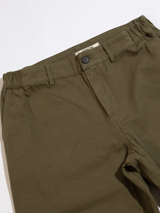 The front of the Aberlour Pants by KESTIN, made from a green cotton canvas.